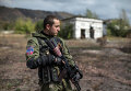 Боец народного ополчения возле места массового захоронения в поселке Нижняя Крынка Боец народного ополчения возле места массового захоронения в поселке Нижняя Крынка