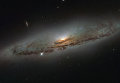 Спиральная галактика NGC 4845 снятая космическим телескопом Хаббл Спиральная галактика NGC 4845 снятая космическим телескопом Хаббл