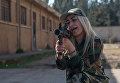 Женщина - доброволец сирийской армии на занятиях в 130-й учебной бригаде в пригороде Дамаска Женщина - доброволец сирийской армии на занятиях в 130-й учебной бригаде в пригороде Дамаска