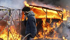 Беспорядки в лагере мигрантов возле Кале, Франция Беспорядки в лагере мигрантов возле Кале, Франция