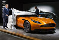 Генеральный директор Aston Martin Энди Палмер с новой моделью автомобиля DB11 на 86-м международном автосалоне в Женеве. Март 2016 Генеральный директор Aston Martin Энди Палмер с новой моделью автомобиля DB11 на 86-м международном автосалоне в Женеве. Март 2016