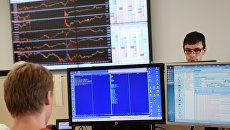 Сотрудники в офисе группы Московская Биржа ММВБ-РТС. Архивное фото Сотрудники в офисе группы Московская Биржа ММВБ-РТС. Архивное фото