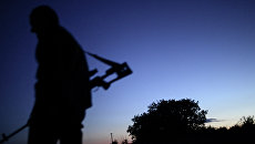 Боец ополчения на окраине Луганска, Архивное фото Боец ополчения на окраине Луганска, Архивное фото