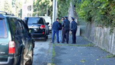 Law enforcement officials near the building of the Abkhazian state telerediokompanii (AGTRK) in Sukhum, where the explosion occurred.  Archival photo