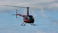 Вертолет Robinson R44. Архивное фото Вертолет Robinson R44. Архивное фото