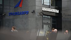 Логотип авиакомпании Трансаэро на здании в Москве. Архивное фото Логотип авиакомпании Трансаэро на здании в Москве. Архивное фото