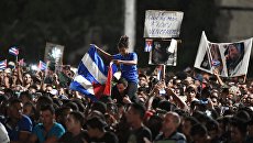 Кубинцы во время митинга в память об ушедшем из жизни лидером кубинской революции Фиделе Кастро. Архивное фото Кубинцы во время митинга в память об ушедшем из жизни лидером кубинской революции Фиделе Кастро. Архивное фото