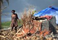 Мари около своего дома, разрушенного ураганом Мэтью, Гаити. 3 ноября 2016 Мари около своего дома, разрушенного ураганом Мэтью, Гаити. 3 ноября 2016