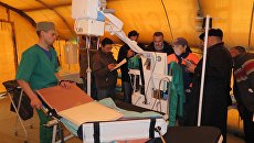 Работа мобильного госпиталя МЧС России в Сирии. Архивное фото Работа мобильного госпиталя МЧС России в Сирии. Архивное фото