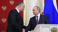 Президент РФ Владимир Путин и президент Молдовы Игорь Додон. Архивное фото Президент РФ Владимир Путин и президент Молдовы Игорь Додон. Архивное фото