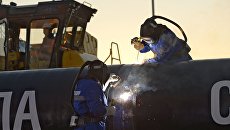 Сварка шва звена магистрального газопровода Сила Сибири. Архивное фото Сварка шва звена магистрального газопровода Сила Сибири. Архивное фото