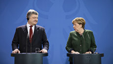 Президент Украины Петр Порошенко и канцлер ФРГ Ангела Меркель. Архивное фото Президент Украины Петр Порошенко и канцлер ФРГ Ангела Меркель. Архивное фото