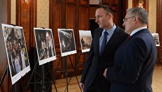 Посетители на открытии фотовыставки Сирия. Фотохроника войны в Вене Посетители на открытии фотовыставки Сирия. Фотохроника войны в Вене