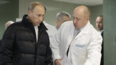Владимир Путин и Евгений Пригожин. Архивное фото Владимир Путин и Евгений Пригожин. Архивное фото