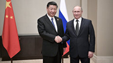 Президент РФ Владимир Путин и председатель КНР Си Цзиньпин во время встречи в Астане. 8 июня 2017 Президент РФ Владимир Путин и председатель КНР Си Цзиньпин во время встречи в Астане. 8 июня 2017