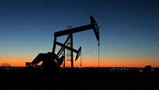Место добычи нефти в Северной Дакоте. Архивное фото Место добычи нефти в Северной Дакоте. Архивное фото