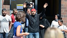 Мигранты во время акции против беженцев в Берлине. Архивное фото Мигранты во время акции против беженцев в Берлине. Архивное фото