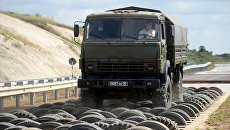 Участники Международного этапа армейских игр Мастера автобронетанковой техники в Острогожске Воронежской области во время тренировки. Архивное фото Участники Международного этапа армейских игр Мастера автобронетанковой техники в Острогожске Воронежской области во время тренировки. Архивное фото