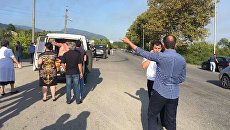Эвакуация людей в районе взрыва в селе Приморское, Абхазия. 2 августа 2017 Эвакуация людей в районе взрыва в селе Приморское, Абхазия. 2 августа 2017