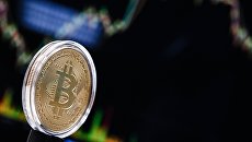 Криптовалюта биткоин. Архивное фото Криптовалюта биткоин. Архивное фото