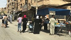 На одной из улиц в Дэйр-эз-Зоре. Архивное фото На одной из улиц в Дэйр-эз-Зоре. Архивное фото