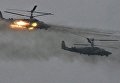 Вертолёты Ка-52 Аллигатор во время совместных стратегических учений (ССУ) вооружённых сил России и Белоруссии на Лужском полигоне в Ленинградской области Вертолёты Ка-52 Аллигатор во время совместных стратегических учений (ССУ) вооружённых сил России и Белоруссии на Лужском полигоне в Ленинградской области