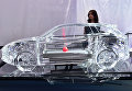 Миниатюрная версия модели Porsche Cayenne на автосалоне в Лос-Анджелесе Миниатюрная версия модели Porsche Cayenne на автосалоне в Лос-Анджелесе
