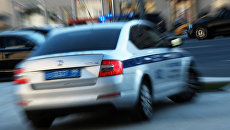 Автомобиль полиции на улице Москвы. Архивное фото Автомобиль полиции на улице Москвы. Архивное фото