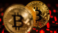 Монета с логотипом криптовалюты биткоин Монета с логотипом криптовалюты биткоин
