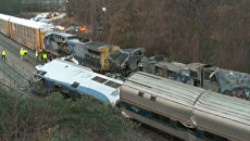 На месте столкновения пассажирского поезда компании Amtrak с грузовым железнодорожным составом в штате Южная Каролина, США. 4 февраля 2018 На месте столкновения пассажирского поезда компании Amtrak с грузовым железнодорожным составом в штате Южная Каролина, США. 4 февраля 2018