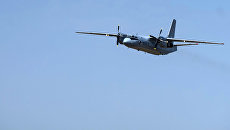 Военно-транспортный самолет Ан-26. Архивное фото Военно-транспортный самолет Ан-26. Архивное фото