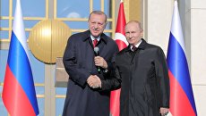 Президент РФ Владимир Путин и президент Турецкой Республики Реджеп Тайип Эрдоган на церемонии запуска строительства первого энергоблока атомной электростанции (АЭС) Аккую в Турции Президент РФ Владимир Путин и президент Турецкой Республики Реджеп Тайип Эрдоган на церемонии запуска строительства первого энергоблока атомной электростанции (АЭС) Аккую в Турции