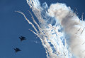 Истребители Су-30СМ пилотажной группы Русские Витязи во время празднования 80-летия Центра показа авиационной техники им. Кожедуба на аэродрома Кубинка в Московской области Истребители Су-30СМ пилотажной группы Русские Витязи во время празднования 80-летия Центра показа авиационной техники им. Кожедуба на аэродрома Кубинка в Московской области