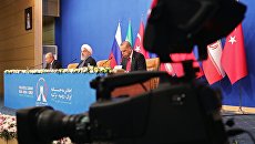 Владимир Путин, президент Ирана Хасан Рухани и президент Турции Реджеп Тайип Эрдоган на пресс-конференции по итогам трехсторонней встречи в Тегеране. 7 сентября 2018 Владимир Путин, президент Ирана Хасан Рухани и президент Турции Реджеп Тайип Эрдоган на пресс-конференции по итогам трехсторонней встречи в Тегеране. 7 сентября 2018