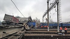 Аварийно-восстановительные работы на месте обрушенного моста в городе Свободном Амурской области Аварийно-восстановительные работы на месте обрушенного моста в городе Свободном Амурской области
