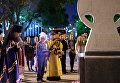 Священнослужитель читает молебен у импровизированного мемориала в Краснодаре в память о погибших при нападении на керченский колледж Священнослужитель читает молебен у импровизированного мемориала в Краснодаре в память о погибших при нападении на керченский колледж