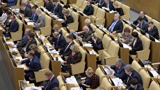 Депутаты на пленарном заседании Государственной Думы РФ. Архивное фото. Депутаты на пленарном заседании Государственной Думы РФ. Архивное фото.