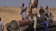 Переходный национальный совет Ливии предложил сторонникам Каддафи сложить оружие Переходный национальный совет Ливии предложил сторонникам Каддафи сложить оружие